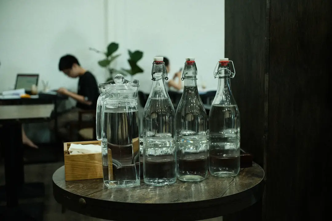 a table with bottles and glasses on it