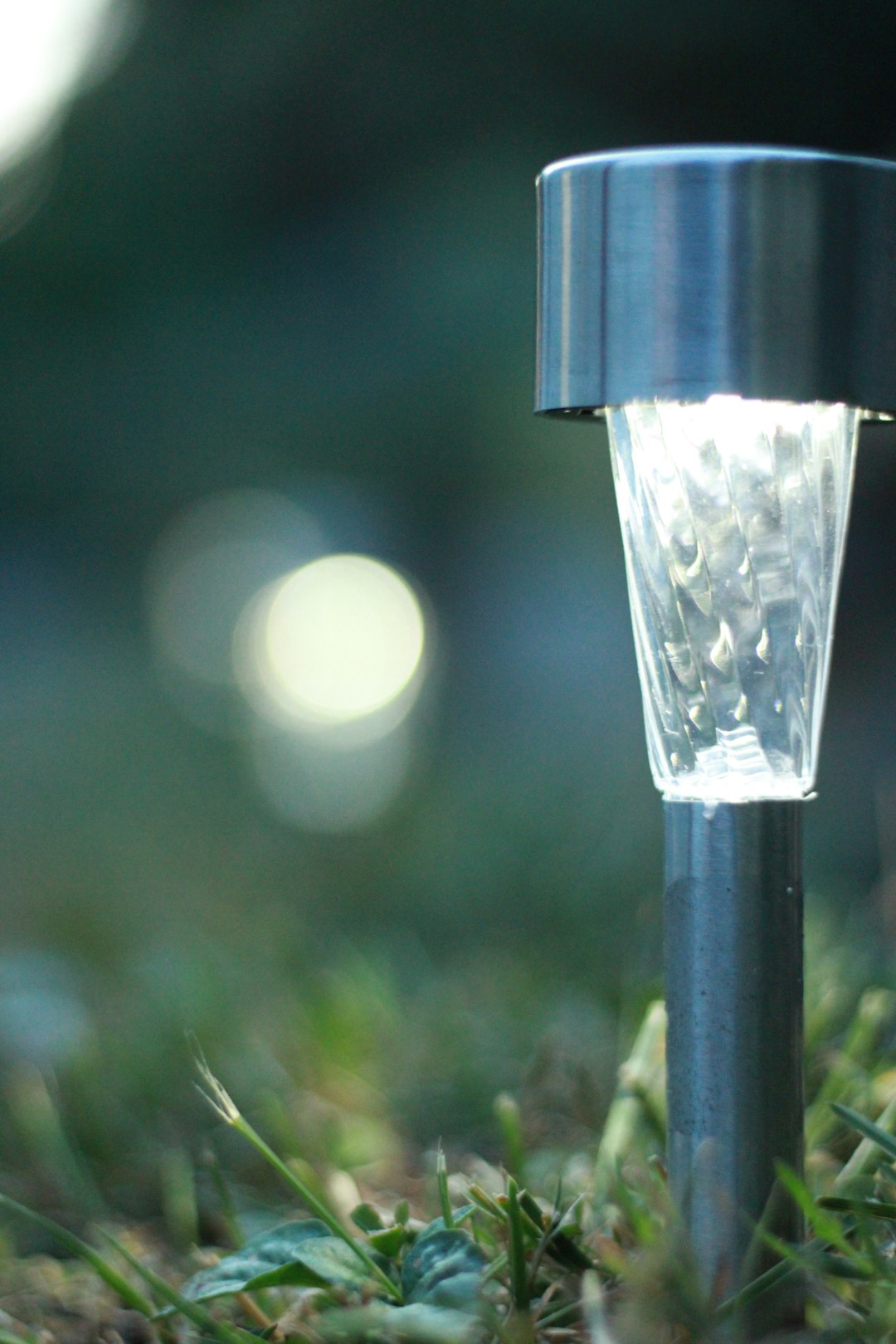 A close up of a light in the grass